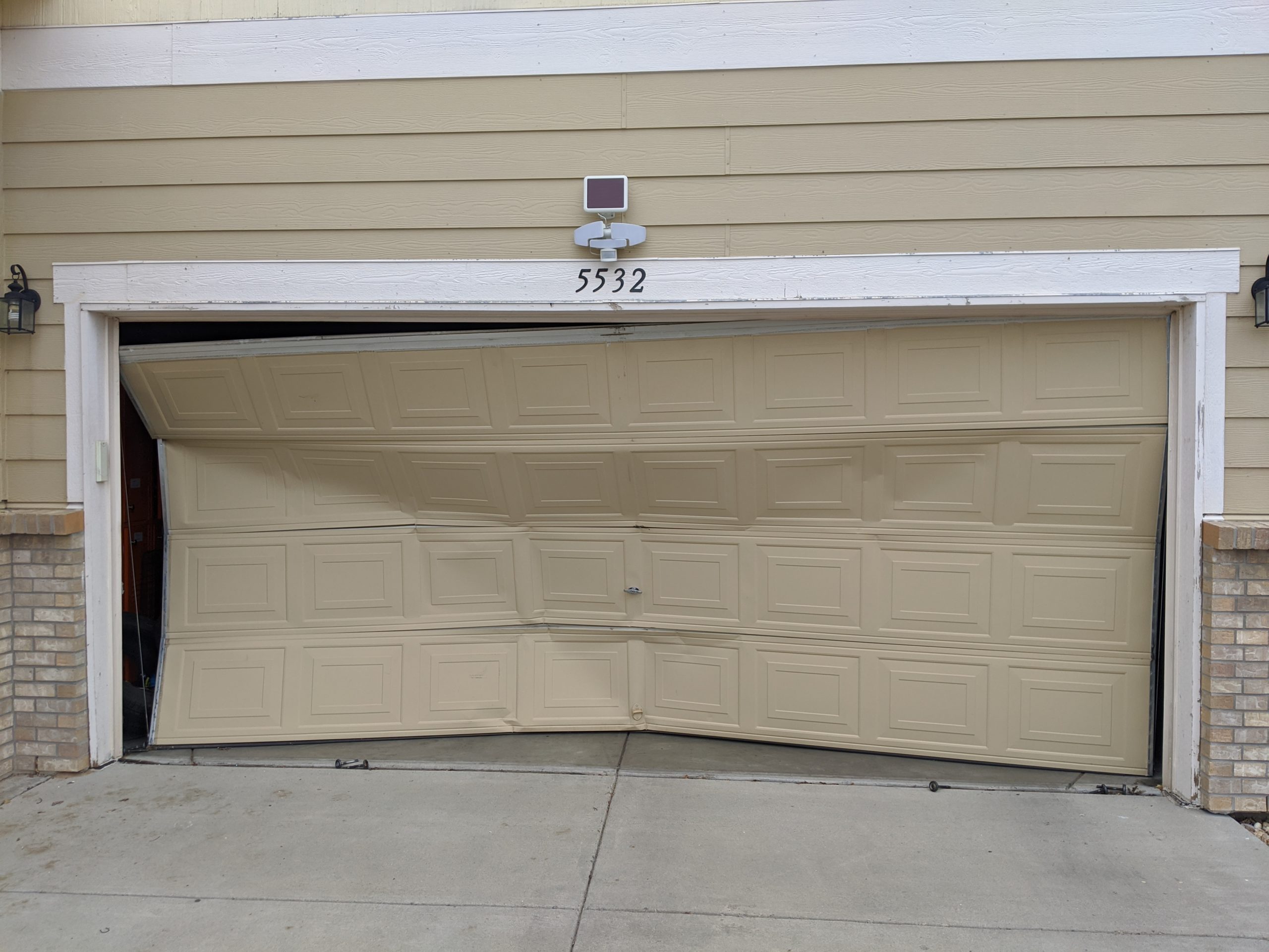 Garage Door After a Car Collision